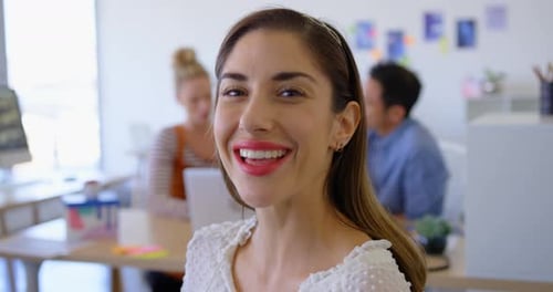 Happy young female executive in modern office 4k