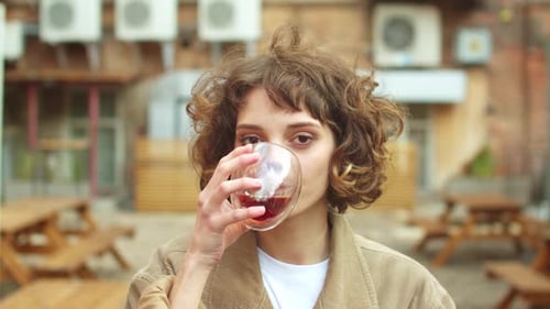 Slow Motion, Girl Coat Stand on the Street, Drink Tea and Laugh