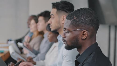 Adults Attending a Meeting Using Technology