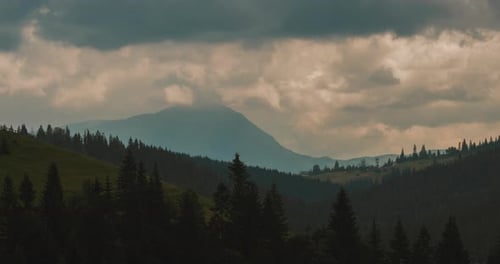 Panoramic view of Carpathians mountains with clouds, overcast sky, morning time
