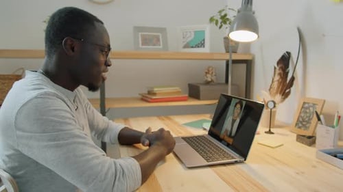 Man Video Calling Using Laptop From Home