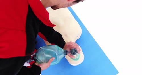 Practicing Rescue Breathing on Medical Training Dummy