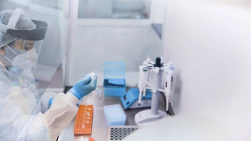 Medical Professional Conducts Test in Brightly Lit Lab