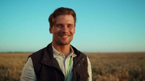 Portrait Smiling Agricultural Worker Posing at Golden Husbandry Field Alone