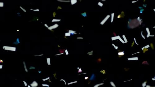 Falling Confetti: Celebration on Black Background