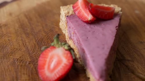 Close-up View of Fresh Strawberries with Slice of Strawberry Cheesecake Rotate