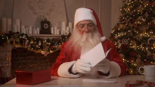 Santa Claus Reading a Letter at Christmas Time
