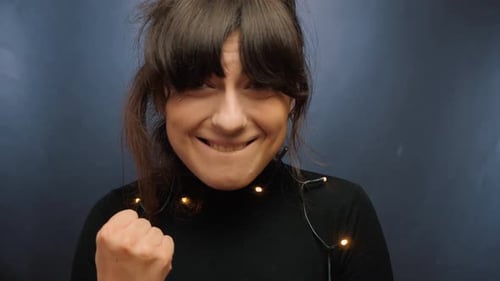 Woman Reacts Joyfully to Success Giving Thumbs Up