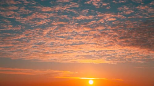 Sunset Cloudy Sky With Fluffy Clouds