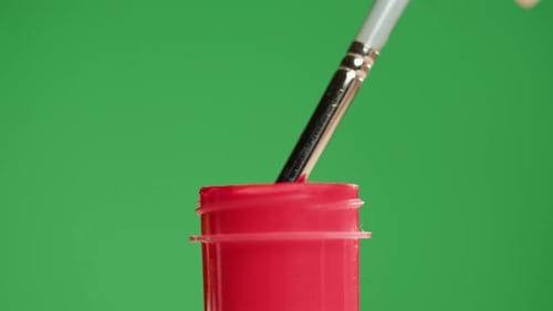 Red Paint Isolated on Green Background