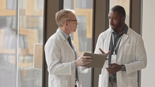 Team of Multiethnic Radiologists Working in Modern Clinic