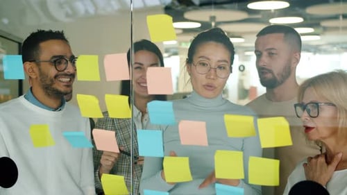 Cheerful People Colleagues Working in Office with Sticky Notes Talking Laughing