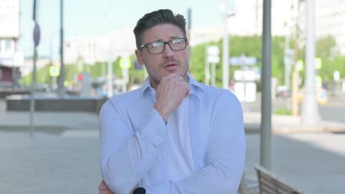 Portrait of Pensive Man Thinking Outdoor