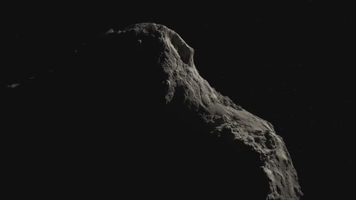 Close-up footage of asteroid turning around in the galaxy. Telescope view.