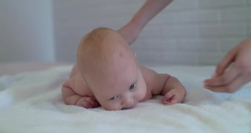 Baby Receiving Gentle Massage on Stomach
