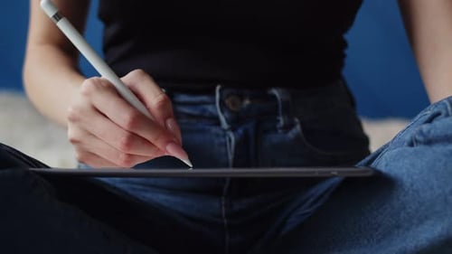 Woman Drawing on Tablet with Stylus