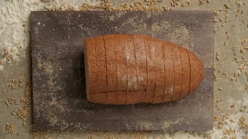 Dark Sliced Bread On Cutting Board