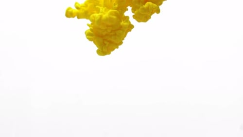 Yellow Ink Cloud Spreads in White Space