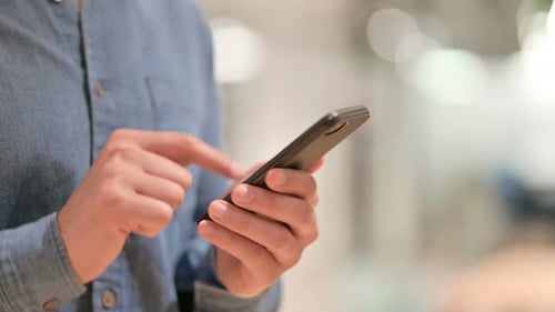 Close Up of Hand Using Smartphone