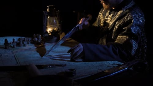 Working under a kerosene lamp in the historical era.