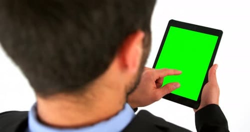 Business executives using digital tablet