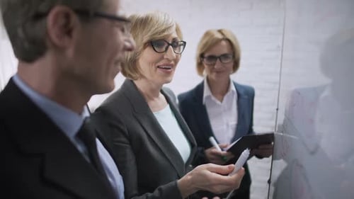 Office Team Brainstorming Together in a Bright Workplace