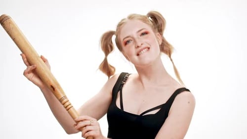 Young Woman Poses With Wooden Baseball Bat