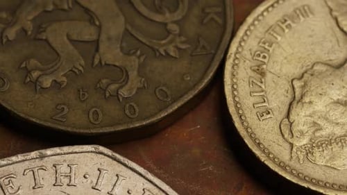 Rotating stock footage shot of international monetary coins