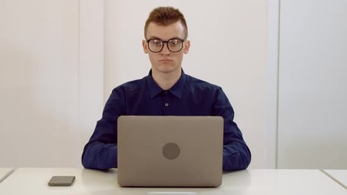 Joker Using Computer at Workplace