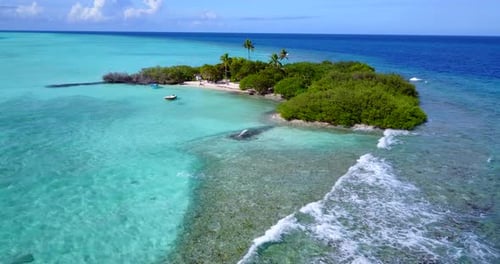 Wide angle drone island view of a paradise sunny white sand beach and aqua blue water background in