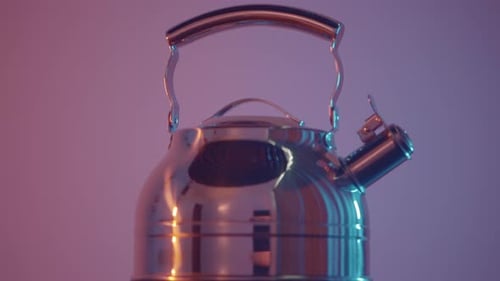 Silver Kettle Close Up with Pink and Blue Lighting