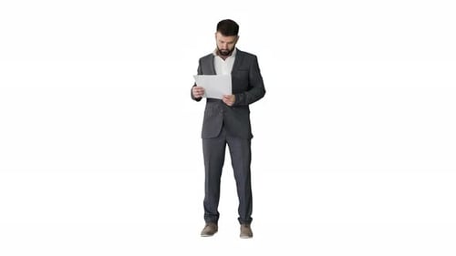 Man in Suit Looking at Papers
