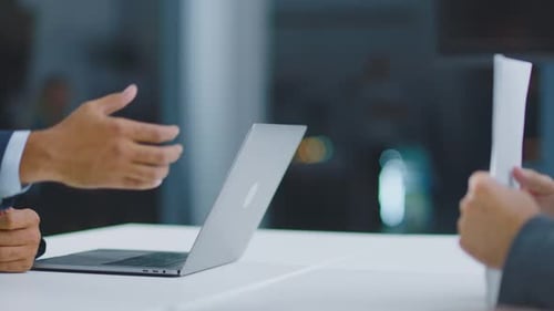 Handshaking above table in office