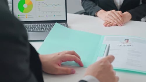 Close up of woman give resume document to apply job to hr manager for job interview in office.