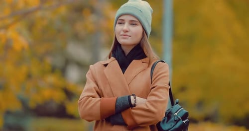 Portrait of a Young Girl in Autumn Park