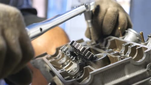 View on Disassembled Motor From Automobile. Unrecognizable Mechanic Repairing Car Engine. Man