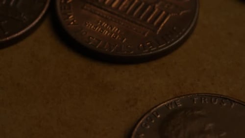 Rotating stock footage shot of American pennies (coin - $0.01) - MONEY 0176