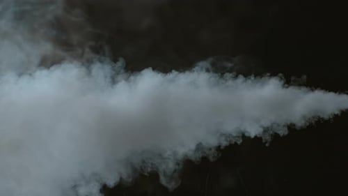 Dramatic Stream of White Smoke on Black Background