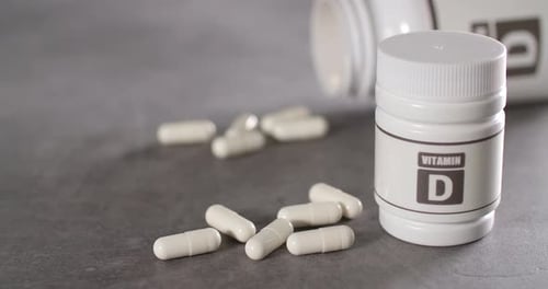 Vitamin D Capsules with White Bottles