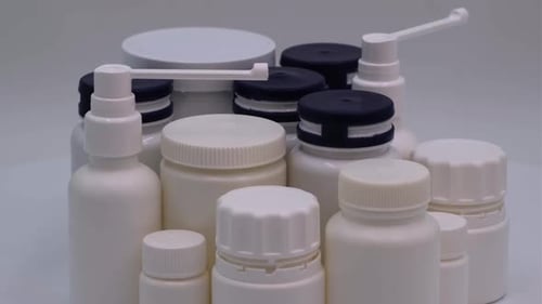 Collection of White Medical and Pharmaceutical Bottles