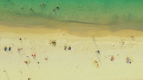 Beautiful water on Kata Noi beach. Drone 4K View of Kata Noi Beach, Phuket, Thailand. Aerial people