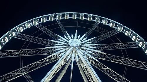 Ferris wheel in amusement park during night time