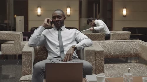 Entrepreneur Talking on Phone in Restaurant