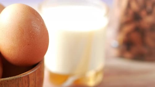 Raw Eggs, Milk, and Almonds for Healthy Recipe