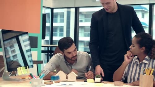 Creative Business People Group Having Conversation at Office Desk in Workplace