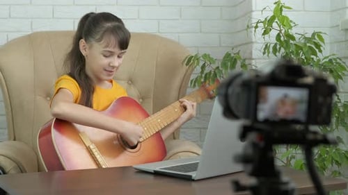 Blogger with a Guitar.