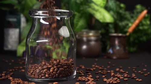 Fresh Coffee Beans Poured Into Glass Jar
