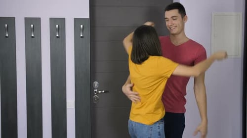 Young Couple Share Loving Surprise at Home