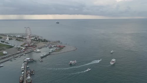 Aerial shot of alphabetic tower, skyscrapers and embankment of beautiful city of Batumi, Georgia