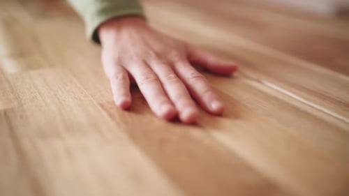 Woman's Hand Touches The Surface Of A Wooden Dining Table. - Closeup Shot